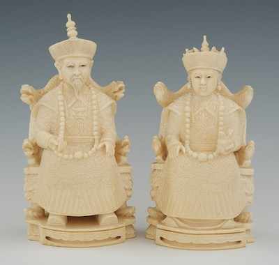 Appraisal: A Carved Ivory Seated Emperor and Emperess Chinese The finely