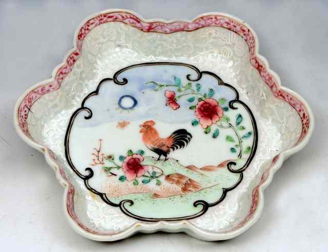 Appraisal: A CHINESE TEAPOT STAND Yongzheng of lobed hexagonal shape painted