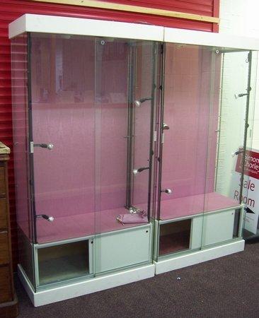 Appraisal: A pair of th Century glass display cabinets with electric