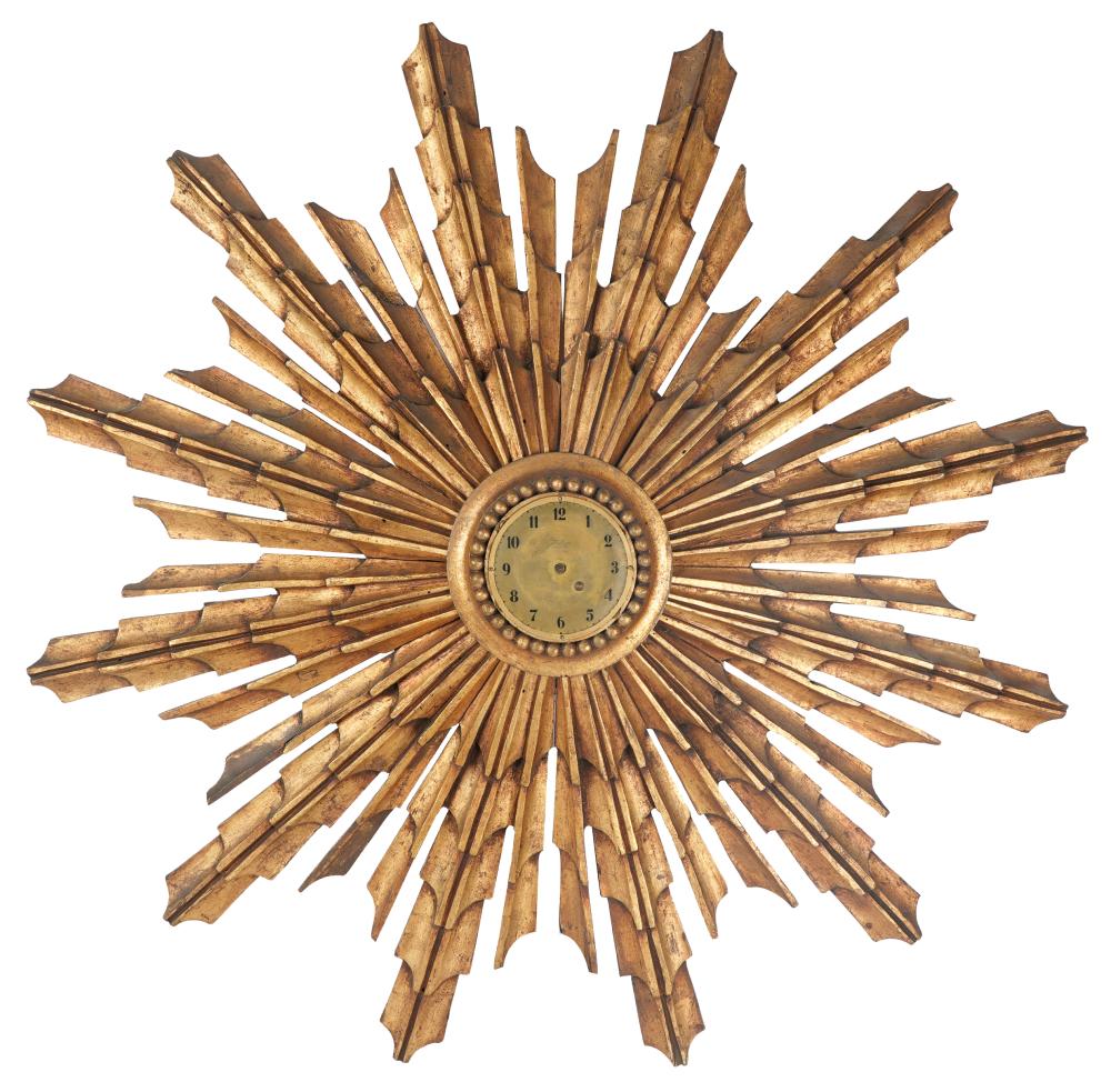 Appraisal: CONTINENTAL GILT CARVED SUNBURST CLOCKpainted wood Movement has been electrified