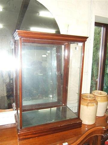 Appraisal: A mahogany four glass table top display cabinet with single