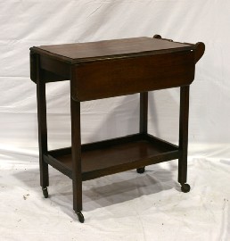 Appraisal: A th century oak tea trolley cm long cm wide