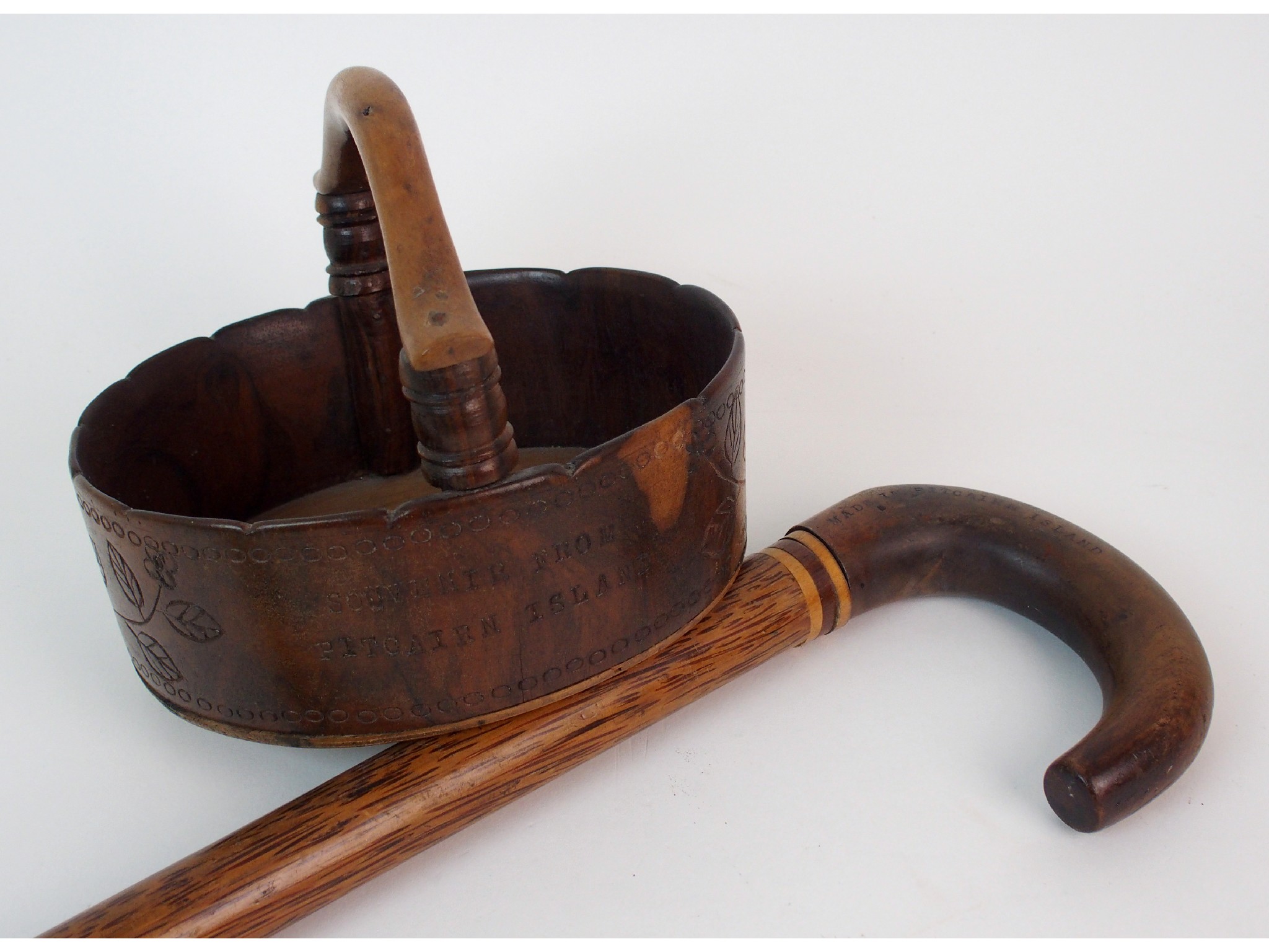 Appraisal: A Pitcairn Island wooden basket with a walking stickthe basket