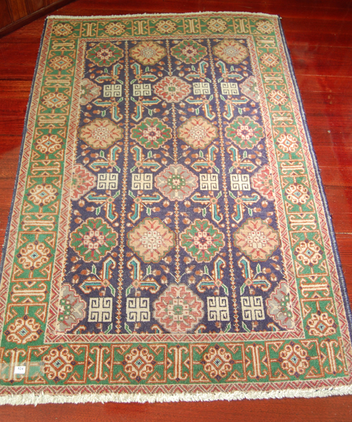 Appraisal: A PERSIAN FLOOR RUG With a blue ground on a