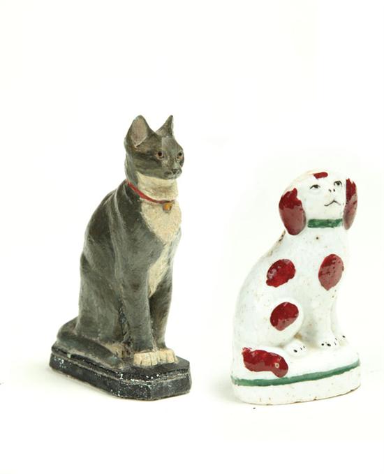 Appraisal: CAT AND DOG FIGURES England th century Cast iron cat