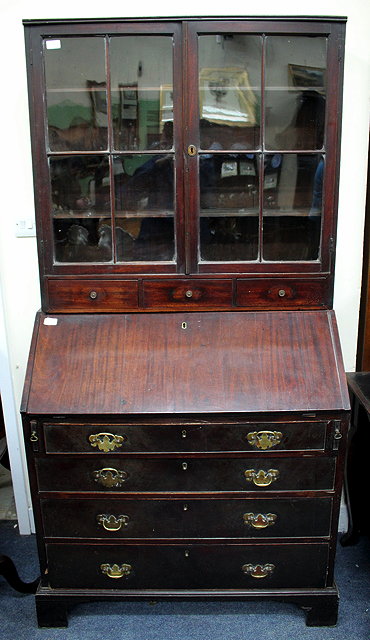 Appraisal: A GEORGIAN MAHOGANY BUREAU standing on bracket feet cm wide