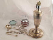 Appraisal: A mixed lot comprising a silver tea strainer silver tongs