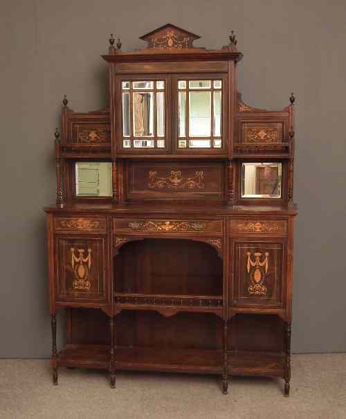 Appraisal: A late Victorian rosewood side cabinet inlaid with urn swag