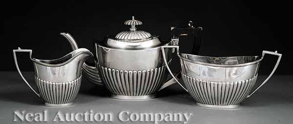 Appraisal: A Vintage Silverplate Tea Service comprising a teapot sugar and