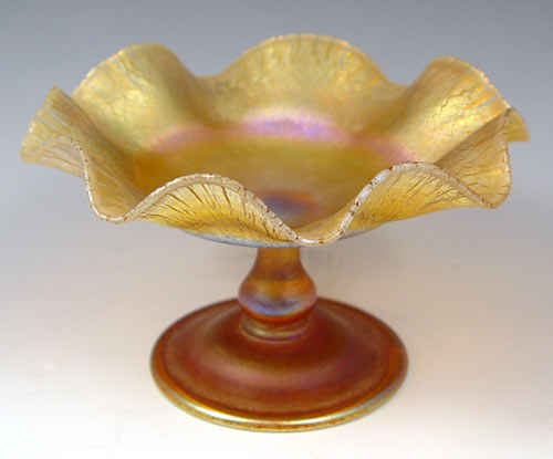 Appraisal: TIFFANY FAVRILE FLOWER FORM COMPOTE Gold iridescent art glass signed