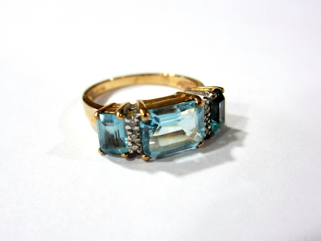 Appraisal: A blue topaz and diamond ring with three step cut