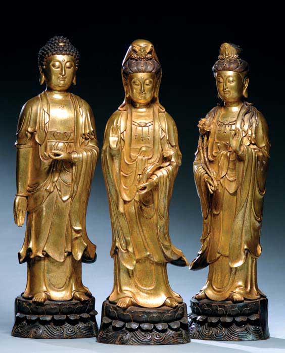 Appraisal: THREE GILT BRONZE FIGURES Group of three Chinese gilt bronze