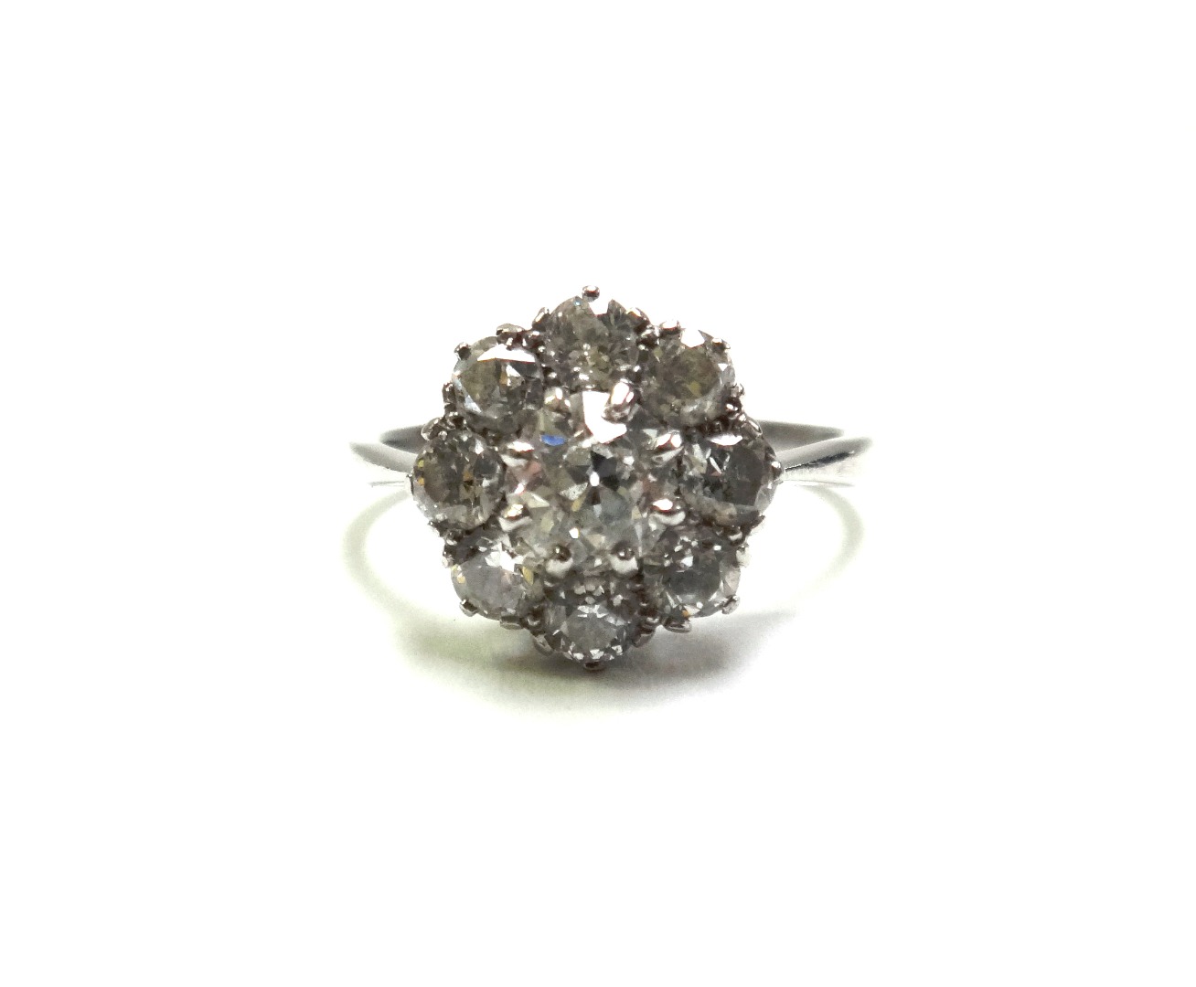 Appraisal: A diamond set nine stone cluster ring claw set with