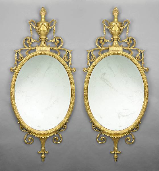 Appraisal: A pair of George III style carved giltwood mirrors th