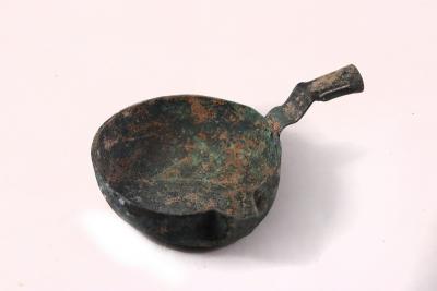 Appraisal: A Han dynasty bronze pouring vessel with handle and spout