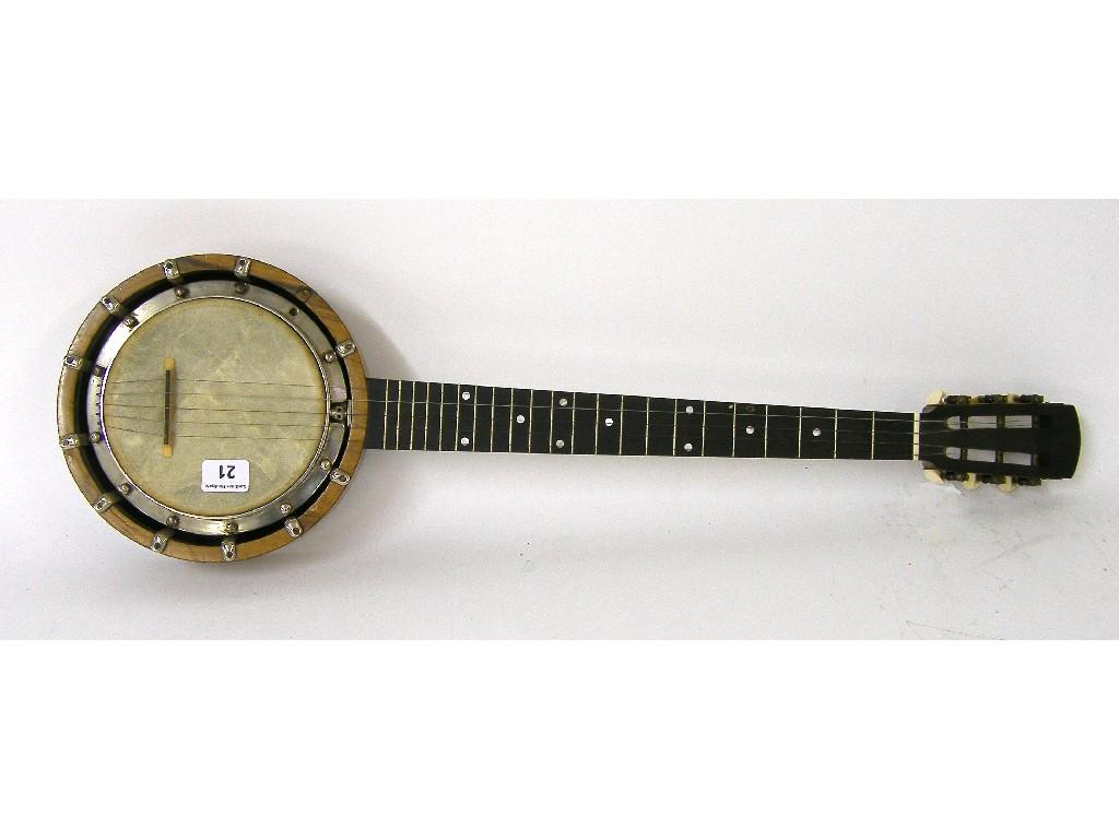 Appraisal: English piccolo banjo by Windsor the ebony open peg box