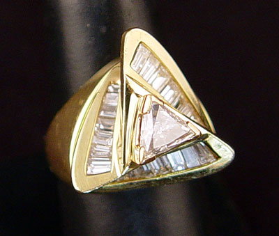 Appraisal: CT TRIANGLE BRILLIANT CUT DIAMOND RING k yellow gold Space