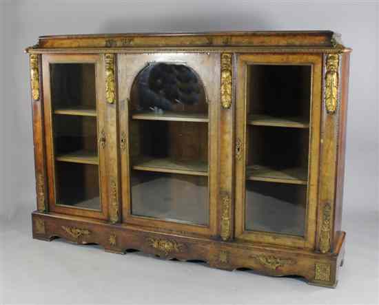 Appraisal: A Victorian walnut and marquetry inlaid display cabinet with three