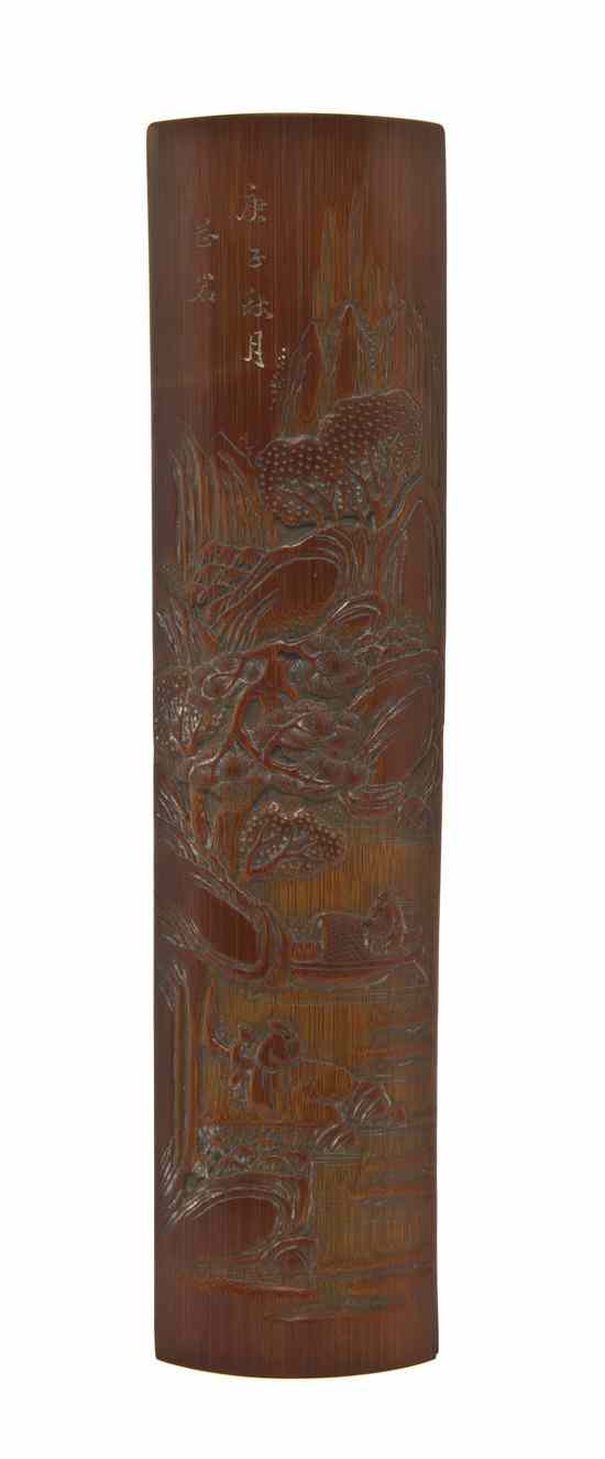 Appraisal: A Bamboo Wrist Rest carved with a river scene with