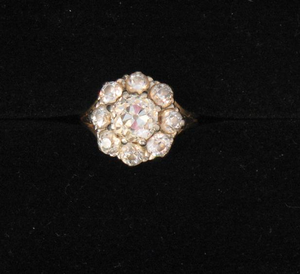 Appraisal: A LARGE DIAMOND CLUSTER RING the central round old-cut diamond