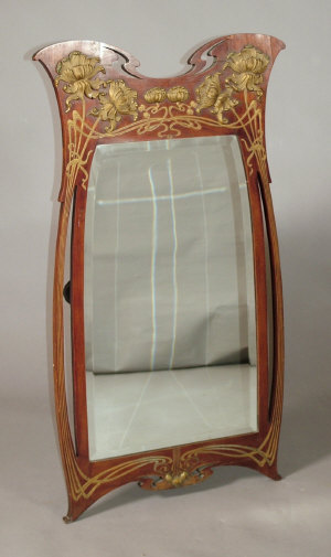 Appraisal: An Art Nouveau wall mirror in the style of Guimard