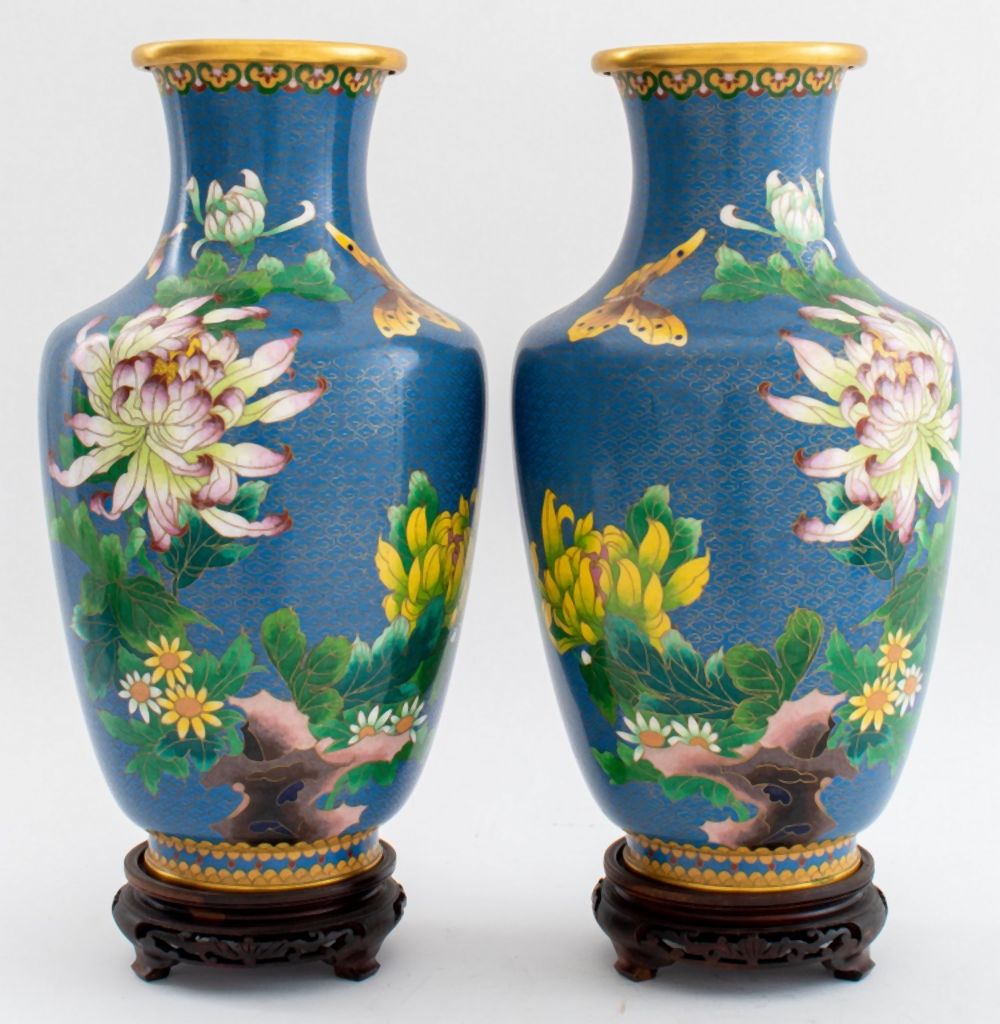 Appraisal: CHINESE CLOISONNE ENAMEL VASES ON STANDS Chinese cloisonne enamel gilt