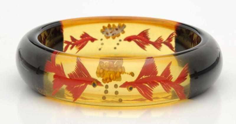 Appraisal: Bakelite Clear Amber Bracelet With fish and floral scene Jewelry