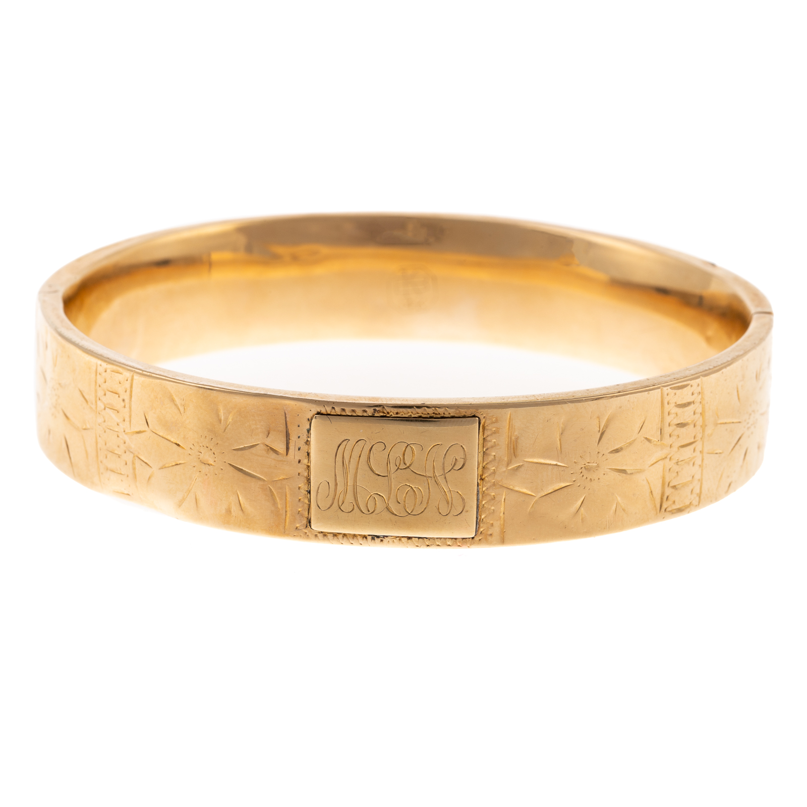 Appraisal: A VINTAGE ENGRAVED BANGLE IN K K yellow gold bangle