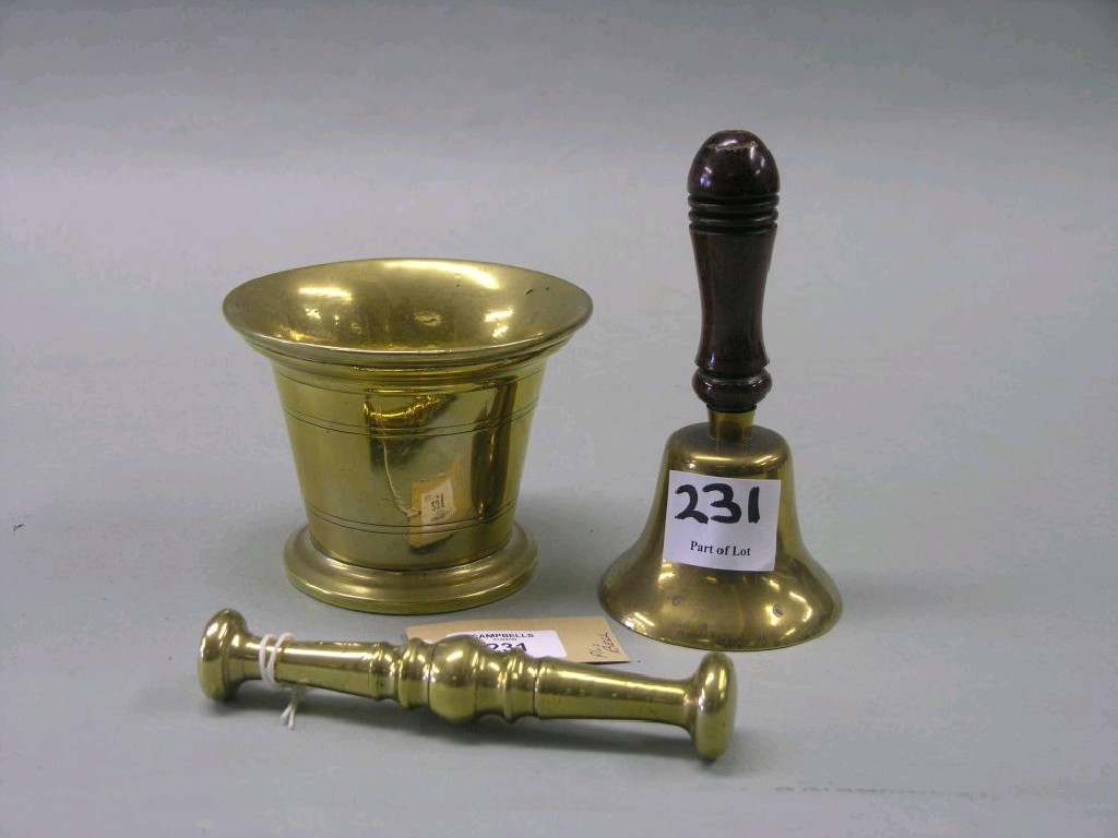 Appraisal: A th century brass mortar with pestle together with a