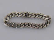 Appraisal: An Italian silver Cuban curb link bracelet import marked Birmingham