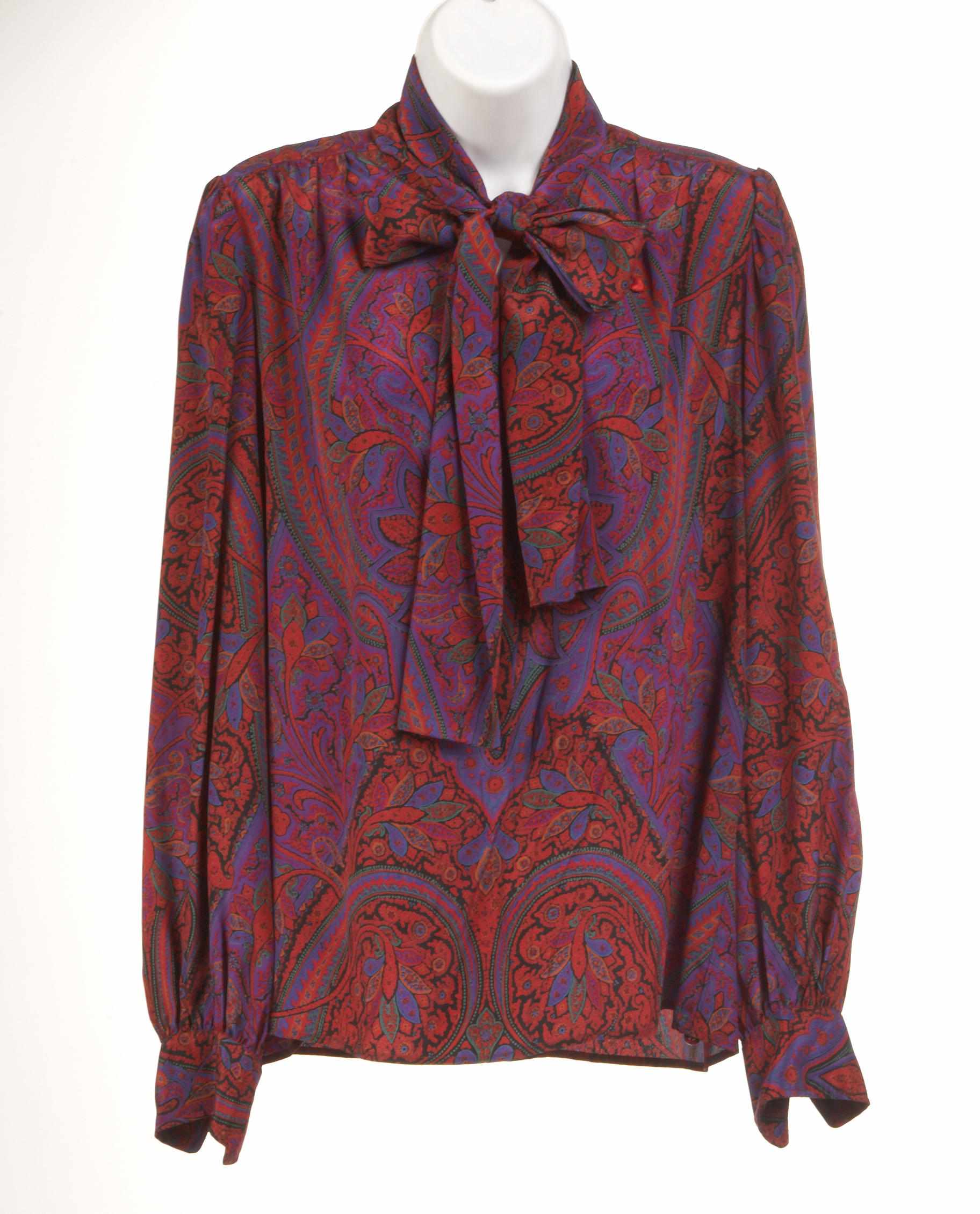 Appraisal: An Yves St Laurent multi colored silk blouse size together