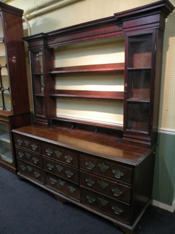 Appraisal: A late thC oak dresser the inverted bow front top