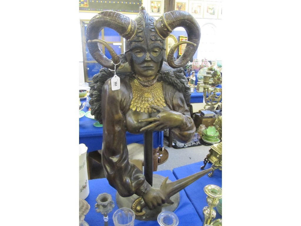 Appraisal: Bronze sculpture of a priestess holding a dagger wearing a