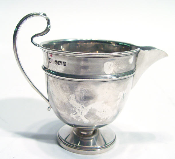 Appraisal: Circular based silver cream jug Sheffield cm high