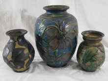 Appraisal: Three ceramic vases with floral motifs two with impressed marks