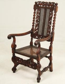 Appraisal: ENGLISH CAROLEAN STYLE CARVED WALNUT ARM CHAIR WITH PUTTI AND