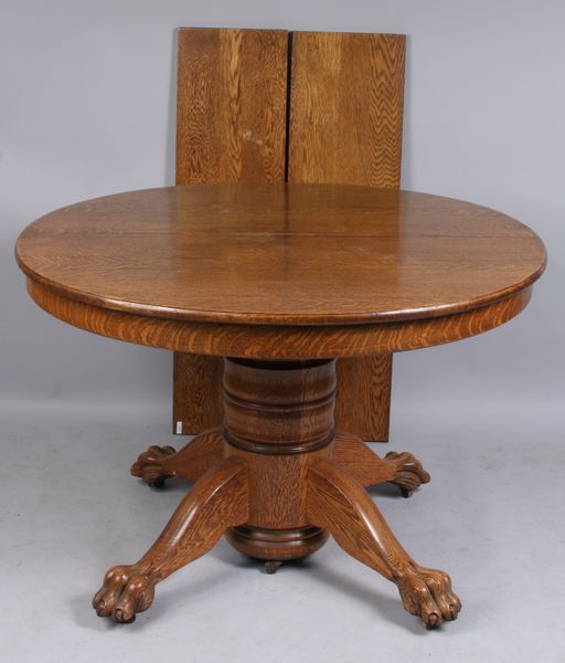 Appraisal: Late th-early th Century round oak dining table with two