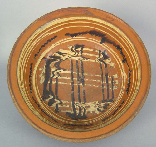 Appraisal: American redware mixing bowl th c with yellow and brown