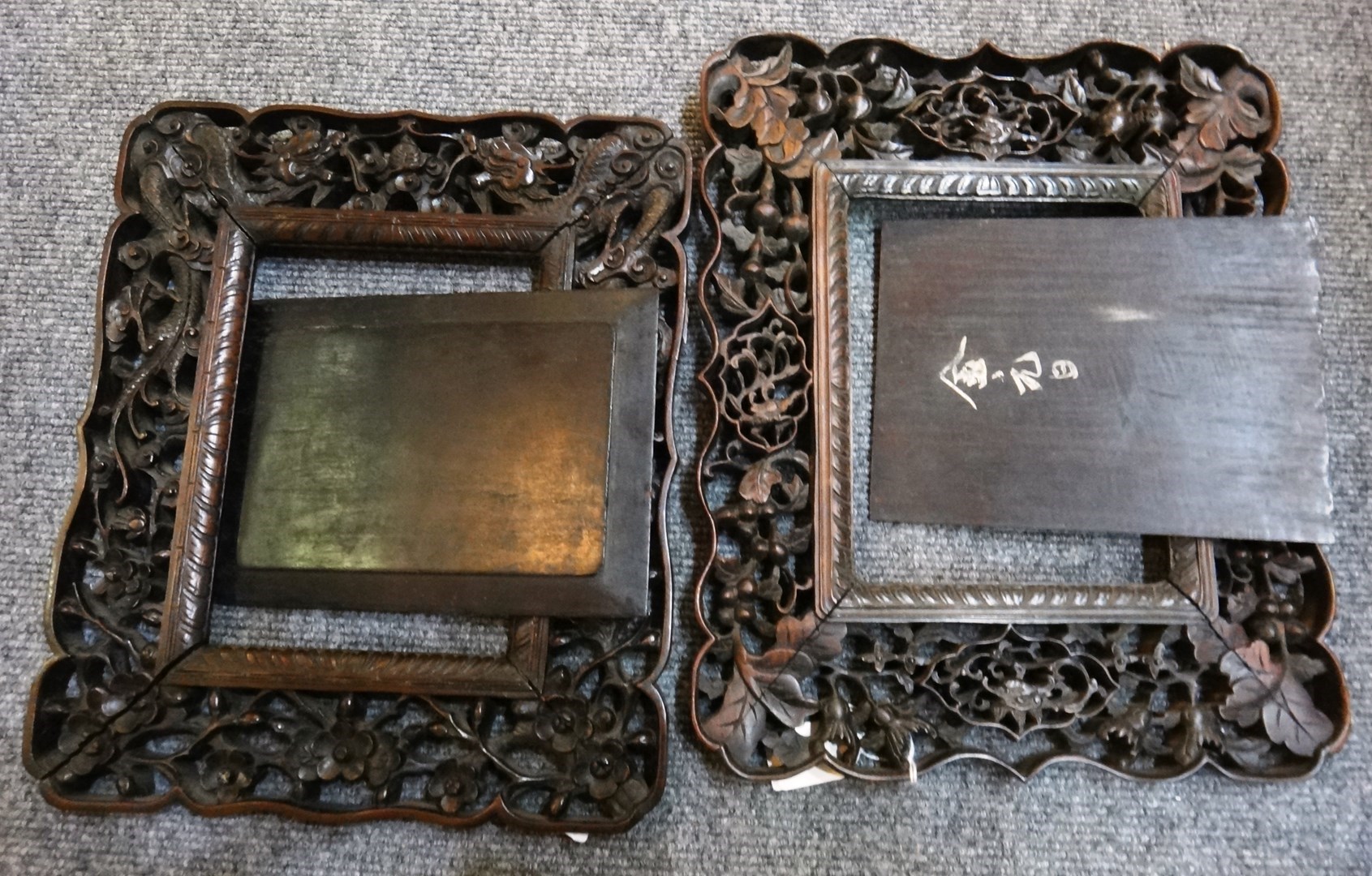 Appraisal: Two Chinese carved and pierced hardwood frames late th th