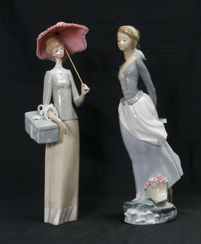 Appraisal: LLADRO PORCELAIN FIGURINES DRESSMAKER Vincente Martinez sculptor issued retired ''h