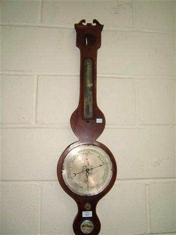 Appraisal: A th Century mahogany cased barometer with swan neck pediment