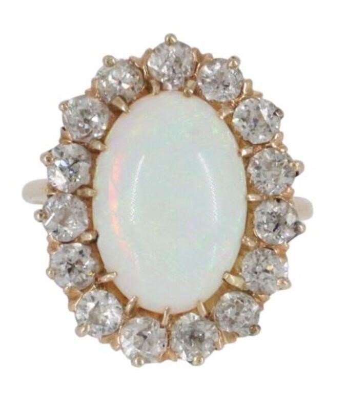 Appraisal: Estate kt yellow gold tested ring opal cabochon framed by