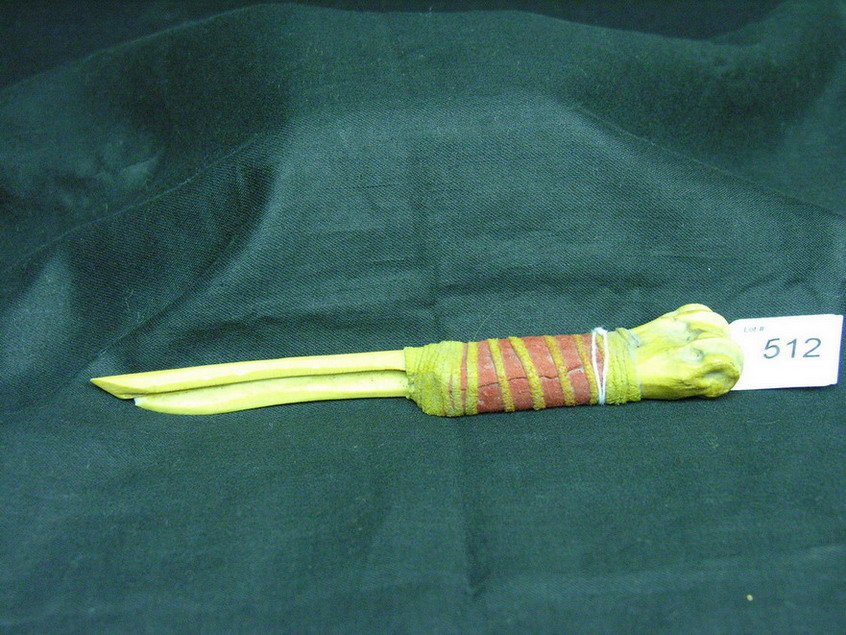 Appraisal: NATIVE AMERICAN BONE AWL LEATHER GRIP Bone awl with dried