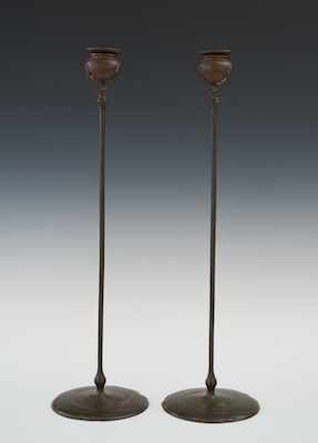 Appraisal: A Pair of Signed Tiffany Studios Candlesticks Tall bronze candlesticks