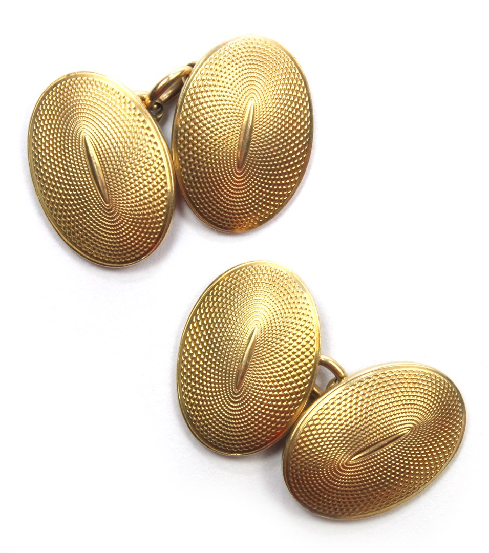 Appraisal: A pair of gold cufflinks the oval backs and fronts