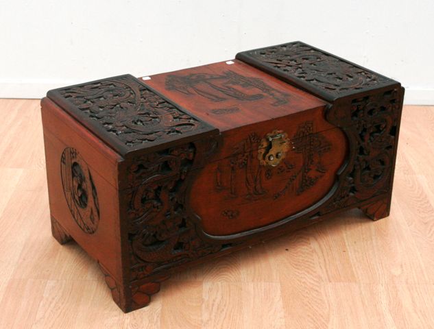 Appraisal: A heavily carved Shanghai Art Deco camphorwood chest circa cms