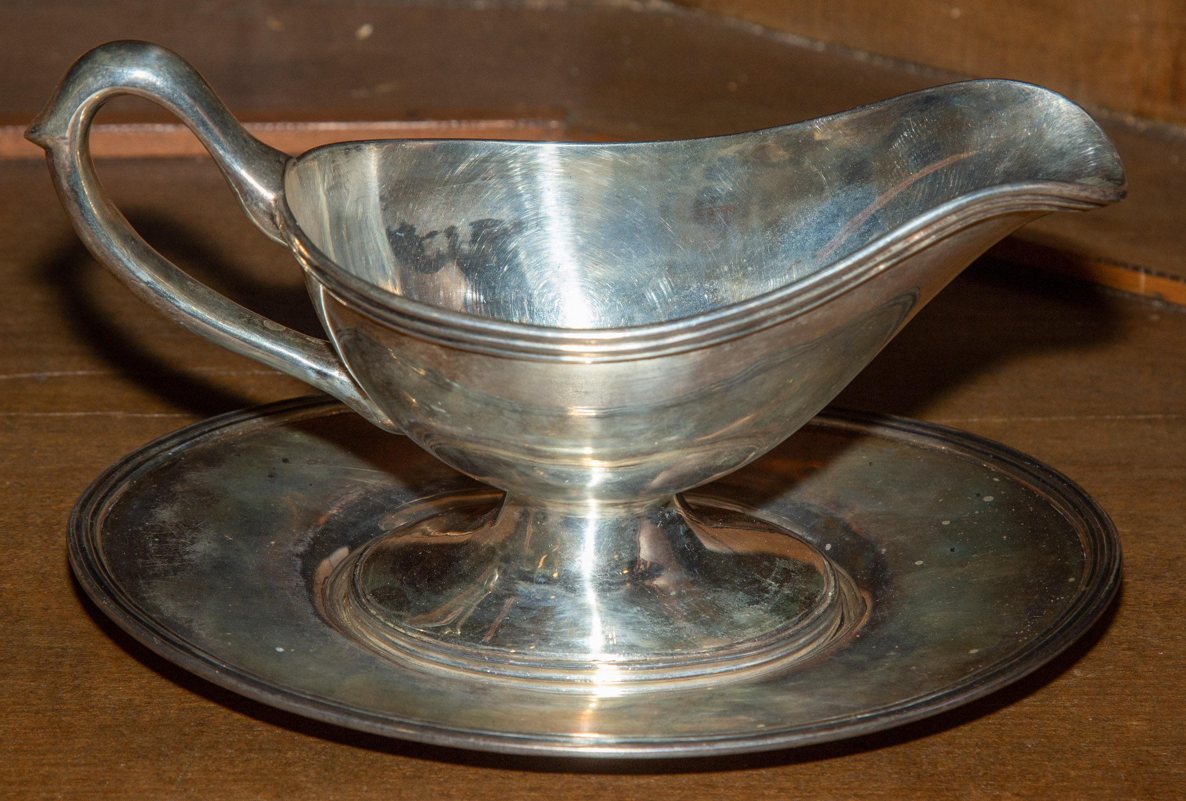 Appraisal: AMERICAN STERLING SAUCEBOAT UNDERTRAY Includes custom-fitted box in H overall