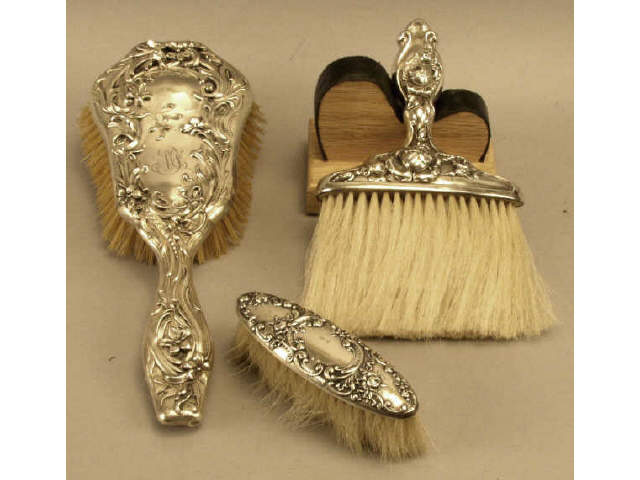 Appraisal: Collection of sterling silver brushes includes hair brush clothing brush