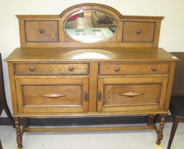 Appraisal: AN OAK SIDEBOARD English early th century the attached back