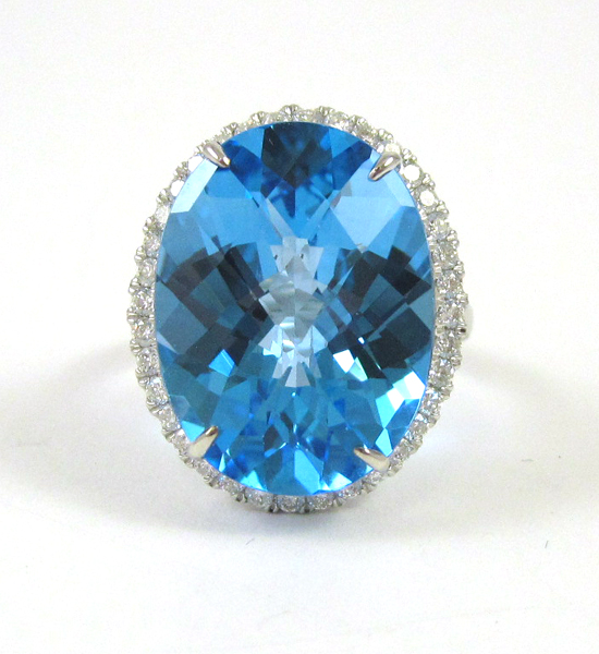 Appraisal: BLUE TOPAZ AND FOURTEEN KARAT WHITE GOLD RING with round-cut